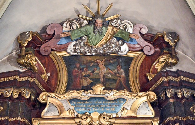 Wyobrażenie męczeństwa św. Wita w szczycie ołtarza głównego